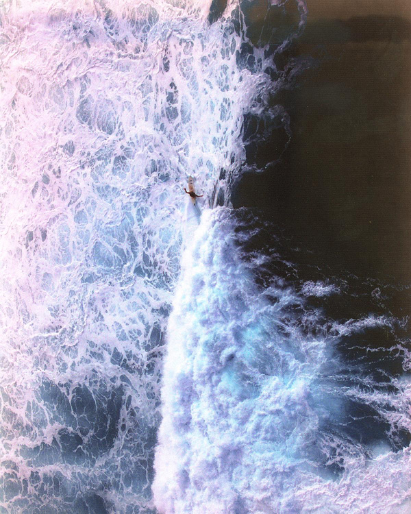 Solitary surfer along the North shore of the Big Island, Hawaii, United States photo